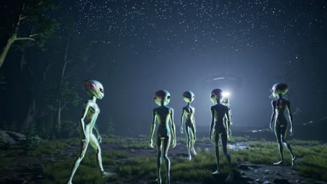 a low-angle video still of aliens in a forest at night, illuminated by a mysterious light