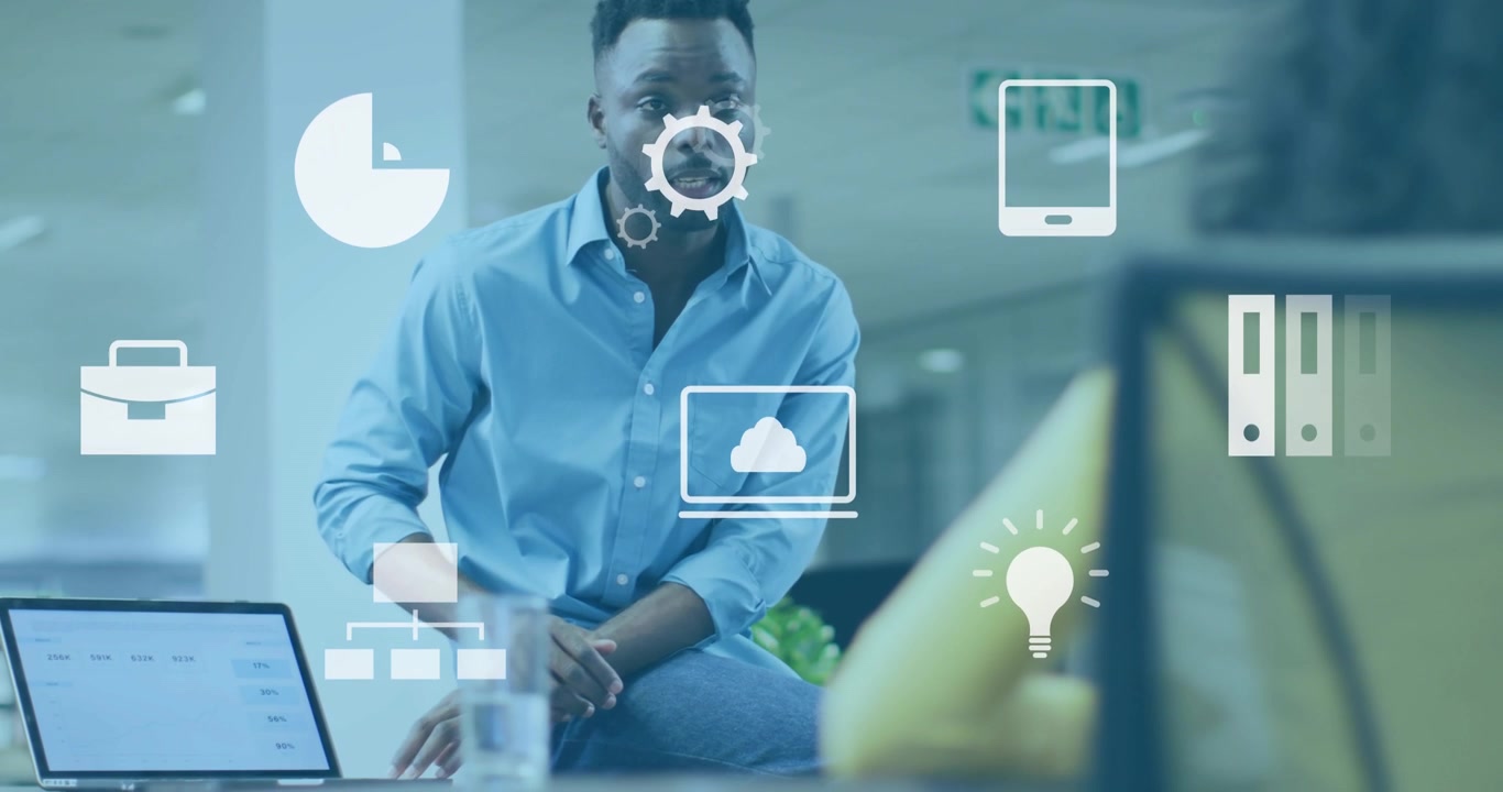 Man tapping laptop charts and showing flowchart with floating icons supporting business decisions