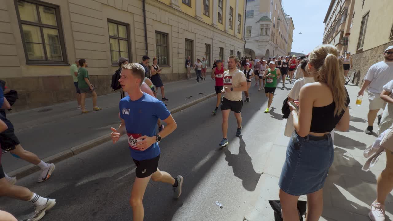 Runners Race At Stockholm Marathon In Sweden. Slow Motion Street View ...