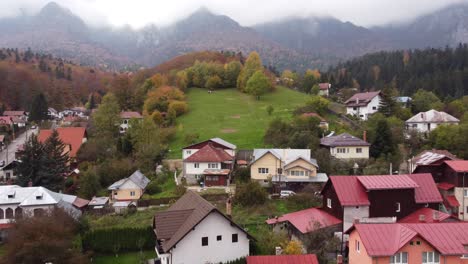 aerial of pasture at mountain in a small village at autumn