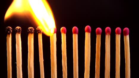 burning matches on a black background.