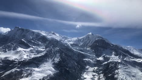 soft iridescence over annapurna three and gangapurna as seen from manang valley in nepal