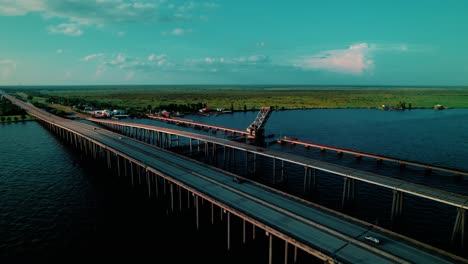 drone view of manchac swamp bridge cutting across vast wetlands and bayou in louisiana