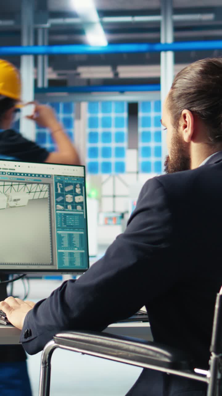 Vertical Video Person With Disability Inspecting Solar Plant Machinery On Computer Screen
