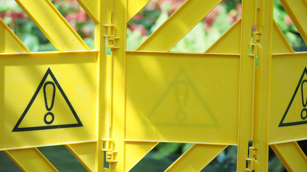 Yellow Plastic Construction Barrier with Warning Sign