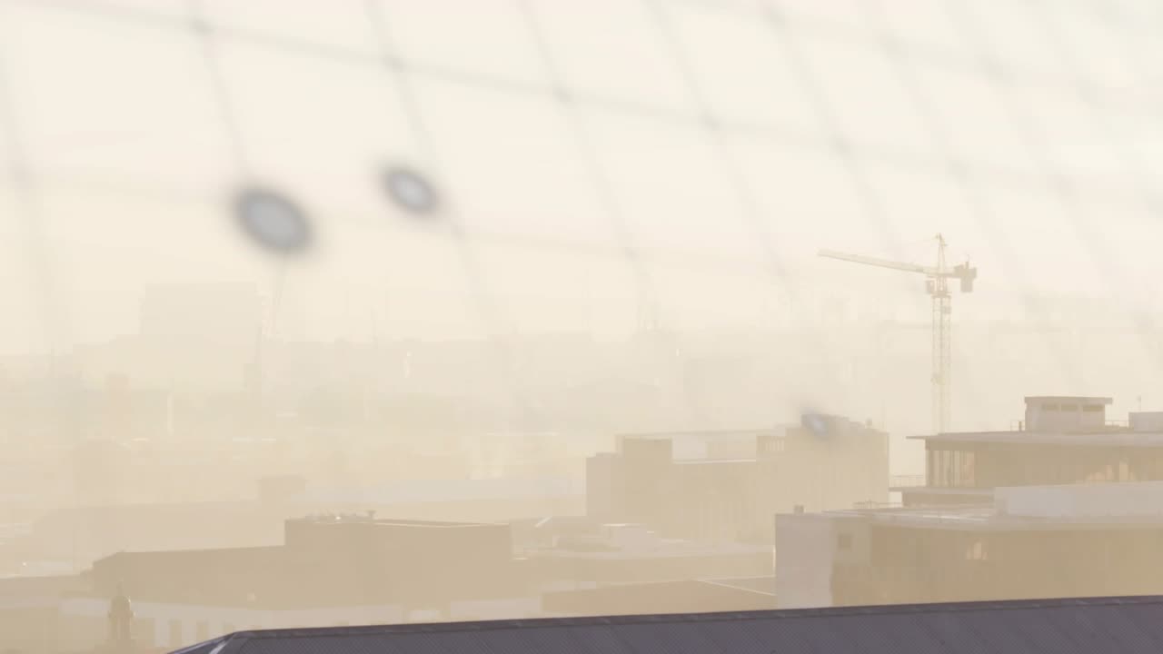 Blur lifting, turquoise data overlay shifting, bars filling, globe appearing, visualizing city data