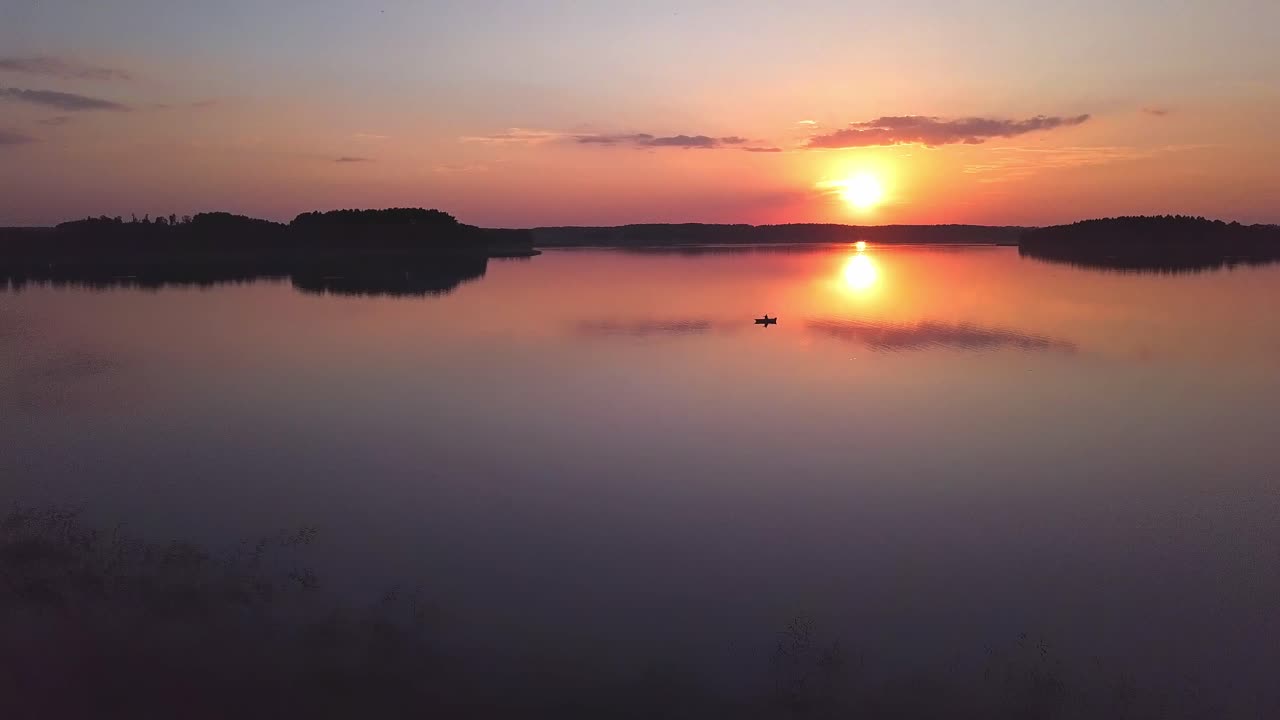 Sunset Over Lake Aerial. Sideways Move