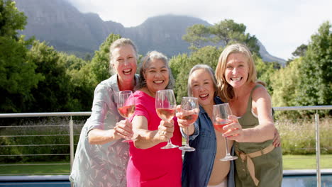 diverse group of women toast outdoors