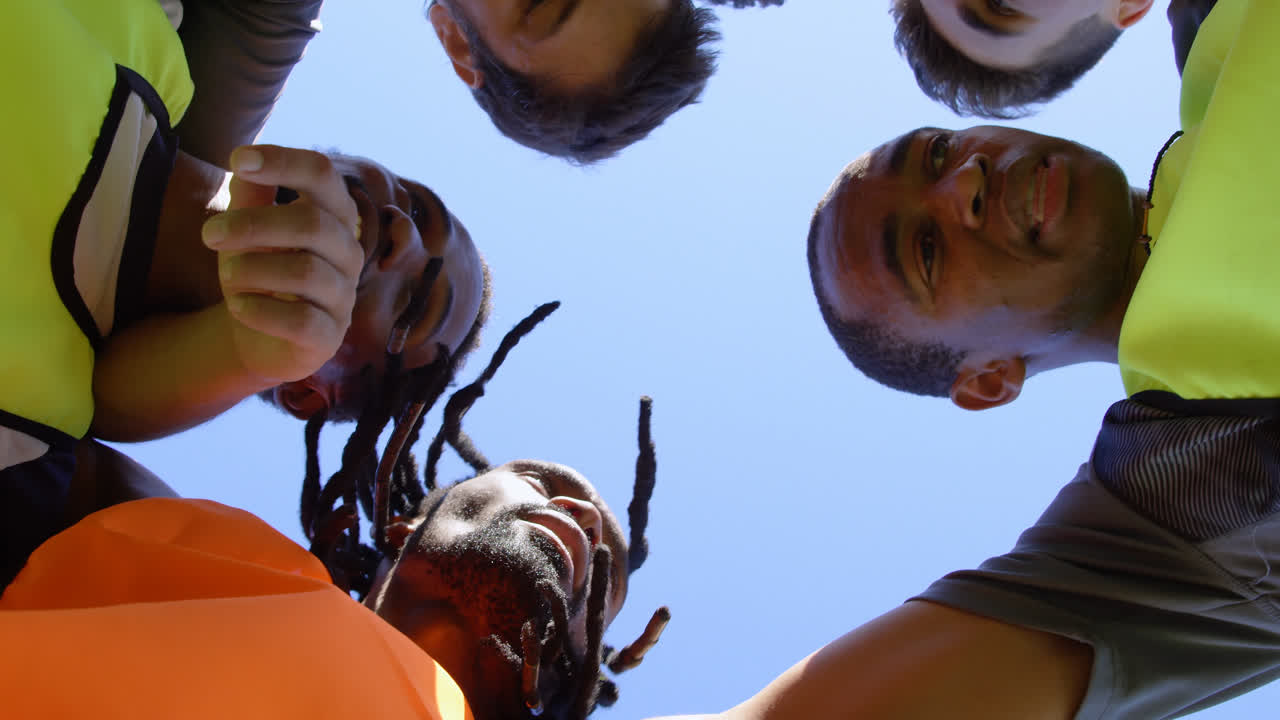 Soccer players forming a huddle 4k