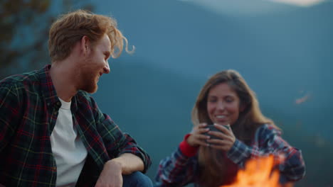 closeup girlfriend boyfriend camping in evening. happy family relax on holiday.