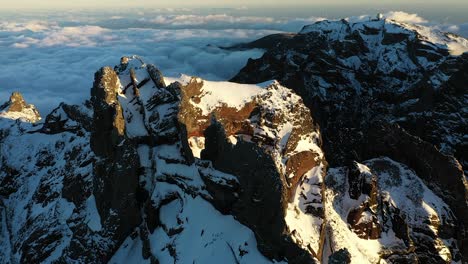 Beautiful-drone-shot-of-the-snow-covered-peaks-of-the-mountain-Pico-Ruivo-in-Madeira