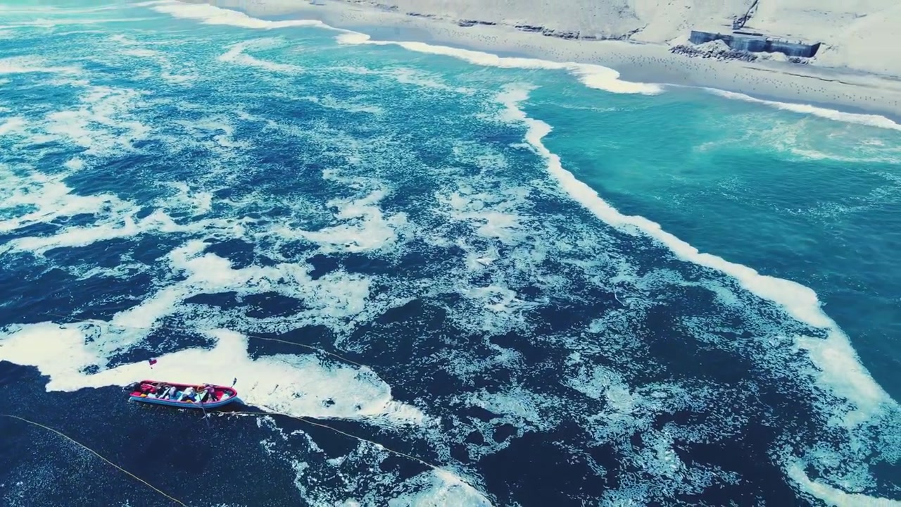 Aerial vista of fisherman on boat in polluted sea