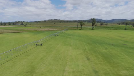 drone flyover of grass farm irrigation system