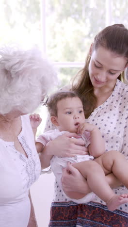 happy extended family with baby