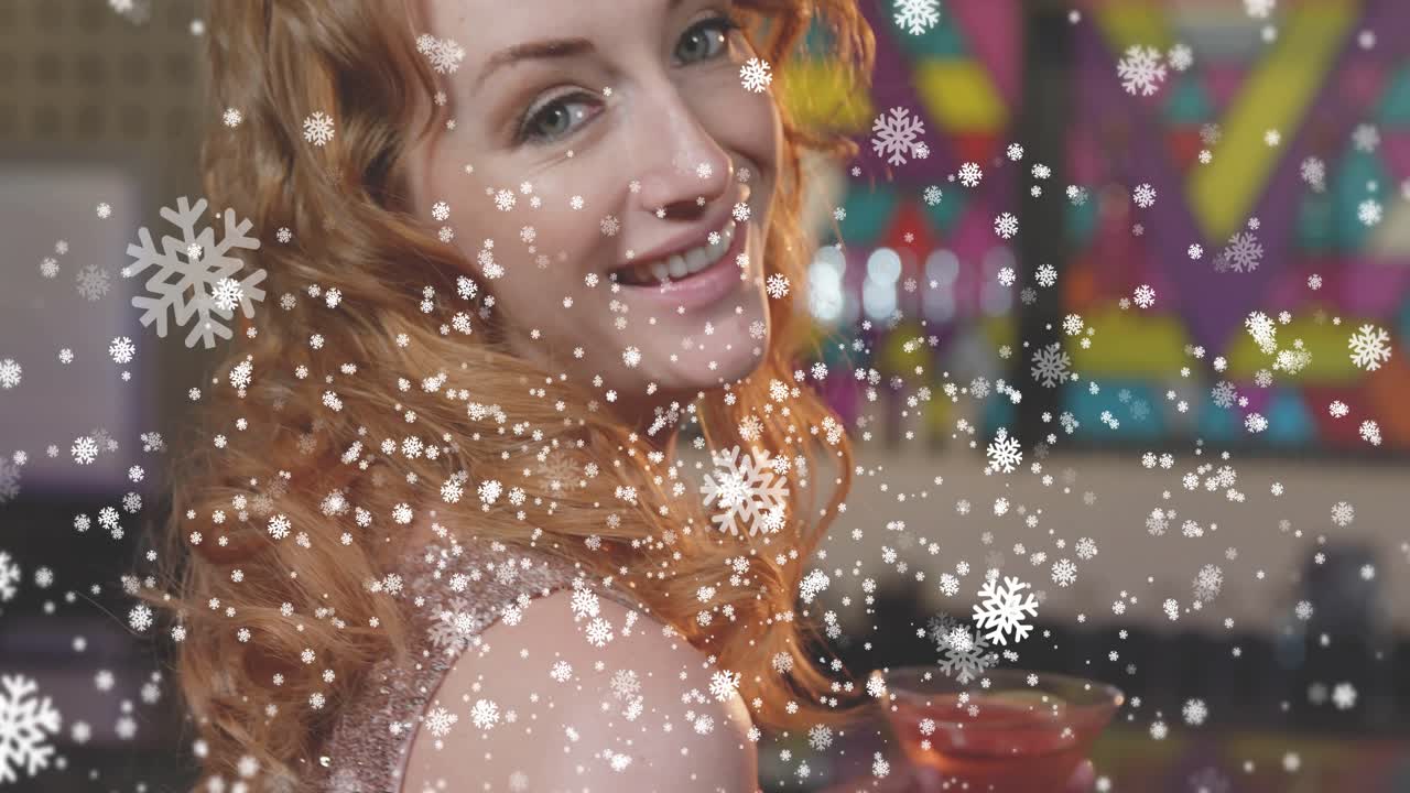 Woman sipping martini at bar, starting falling snowflakes while turning to camera, engaging viewer