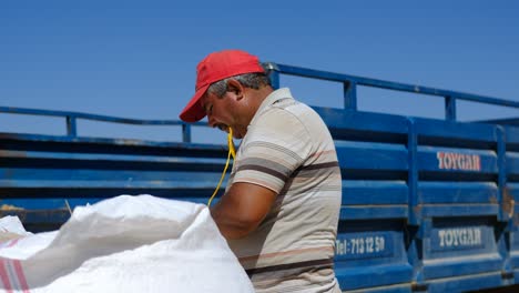 farmer working sack