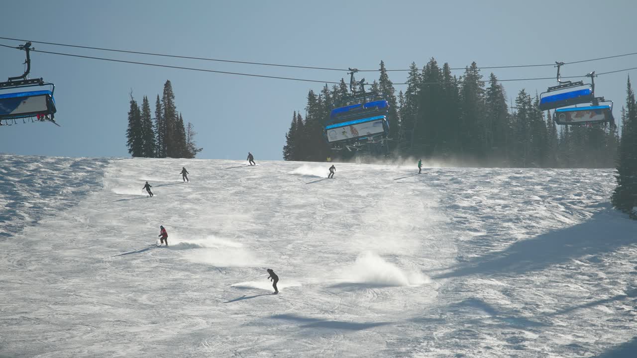 A skier on a nice day skiing fast on a groomed run in Big Sky Montana