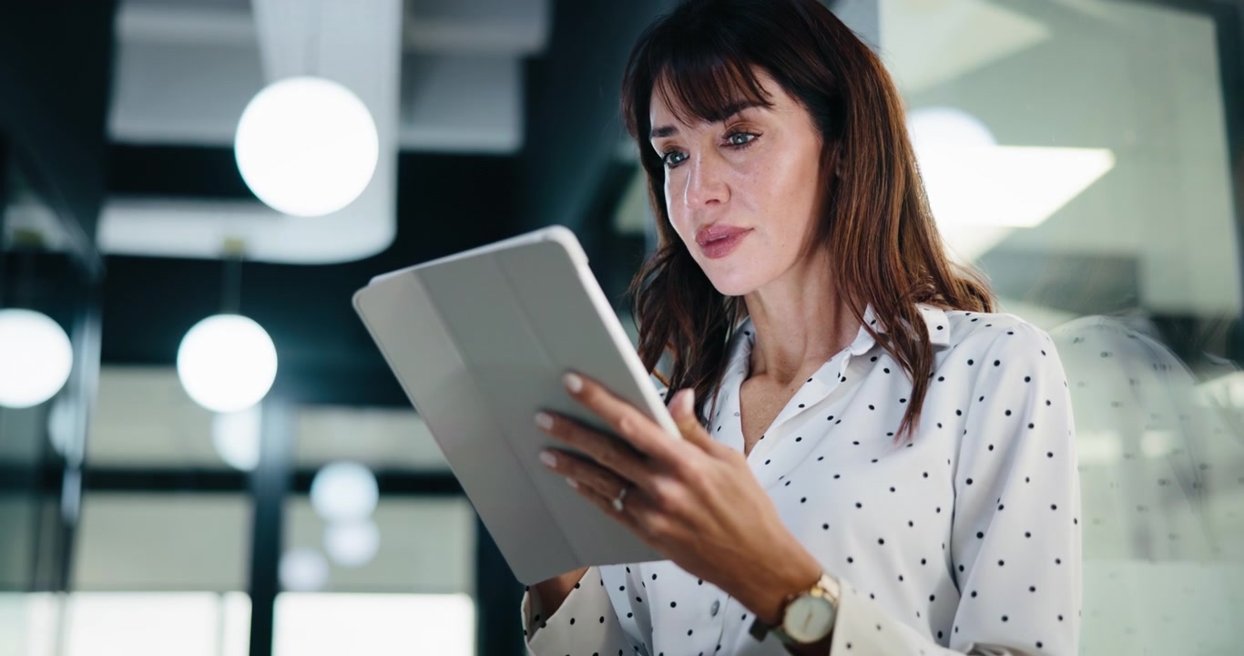 Professional Woman Using Digital Tablet in Modern Office