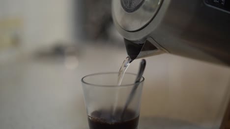 turkish black coffe pouring into glass