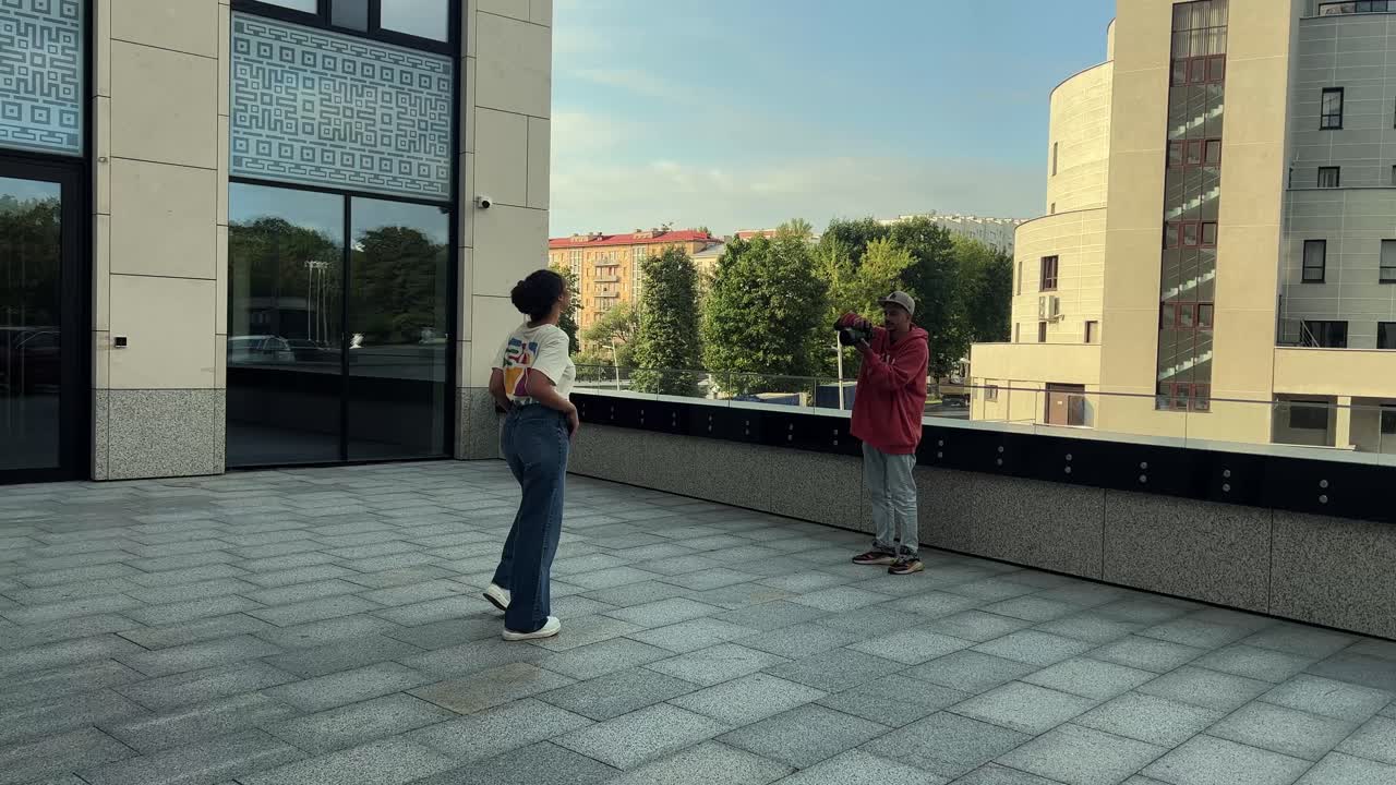 People posing for a photograph in an urban setting