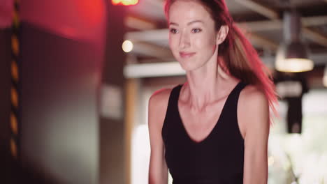 Attractive-Young-Fit-Female-Athlete-Exercising-With-Battle-Ropes-During-Cross-Training-3