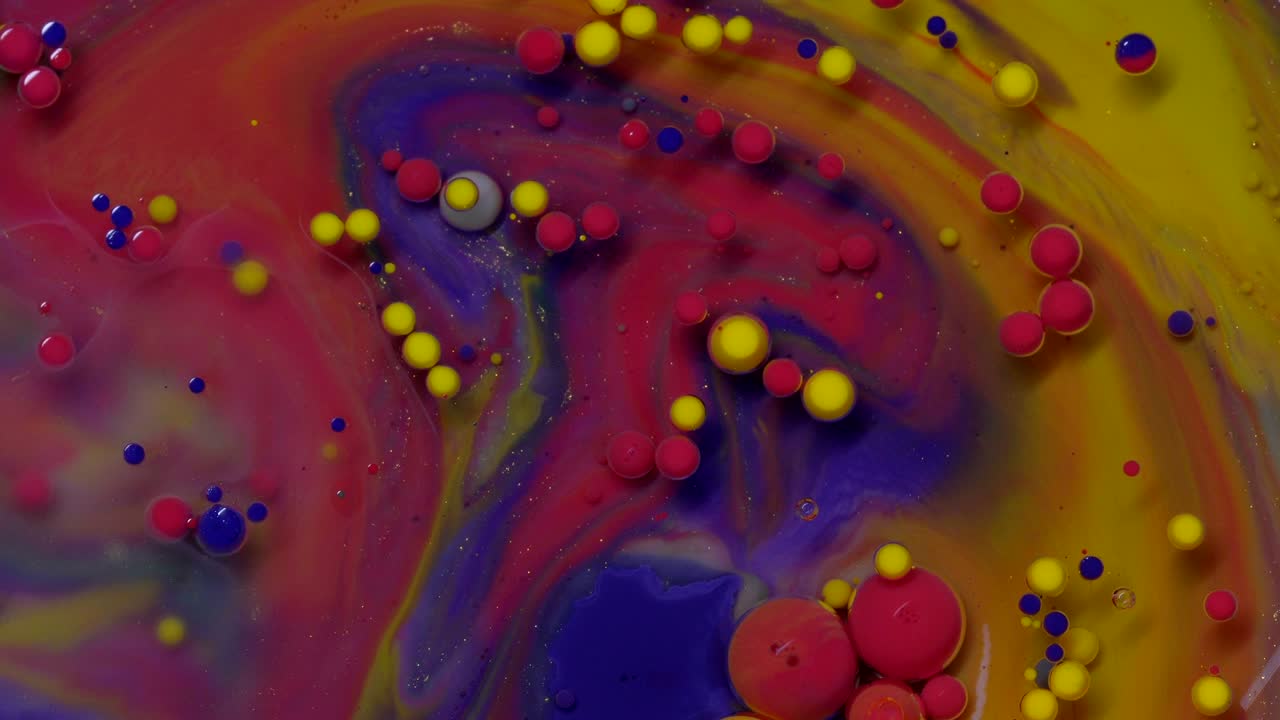 burbujas abstractas de colores. pintura de color macro en flujo dinámico. fondo de textura de movimiento caótico. vista superior