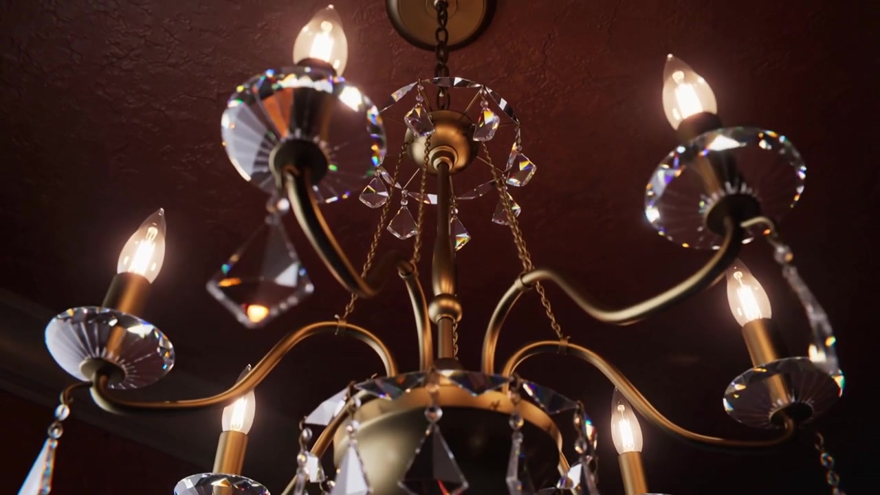 Telecamera in movimento che rivela da vicino un lampadario in ottone su un soffitto bordeaux per mostrare le sfaccettature di cristallo.