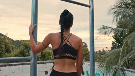 woman in workout gear at sunset