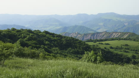 tranquil countryside landscape of majestic mountains and lush fields in rural georgia