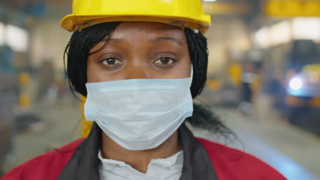 portrait of female factory engineer in mask