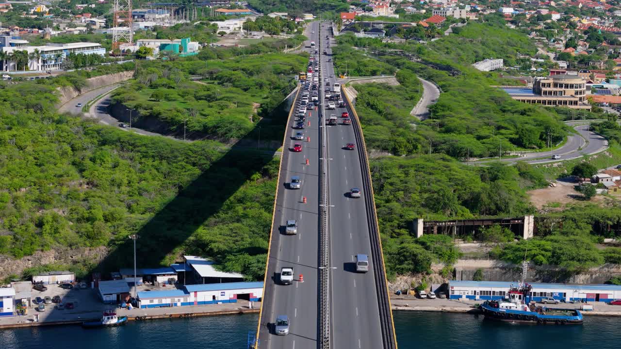 Queen Juliana Bridge, Willemstad Curacao centered bird's eye view as traffic drives both ways