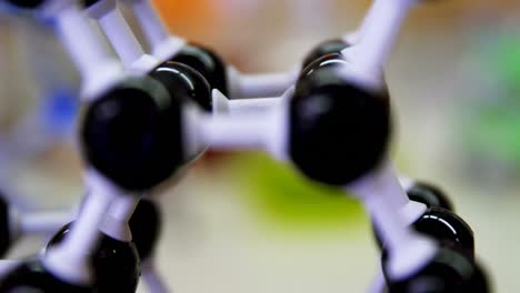 close-up of molecule model and chemicals on table 4k