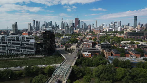 4k drone shot over toronto's east side, with the downtown skyline in the background