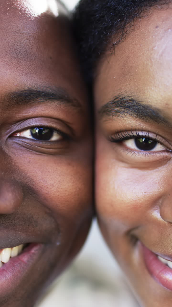 Vertical video: Close-up of couple smiling and embracing, showing love and connection