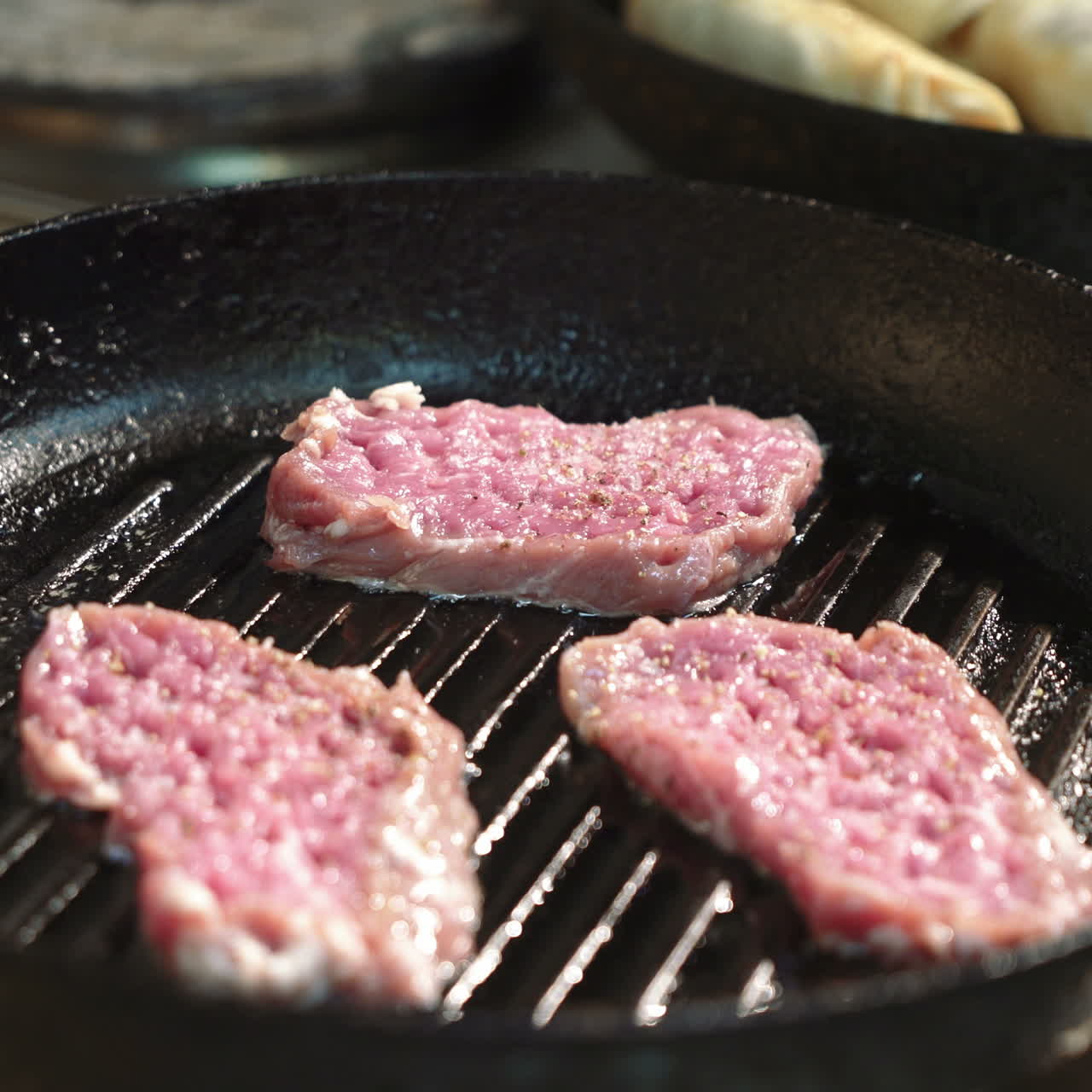 Chef prepares a delicious meat in the grill pan. Perfect steak. Sqare video