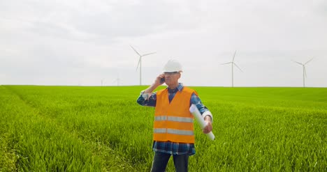 Angry-Engineer-Talking-On-Mobile-Phone-At-Farm-4