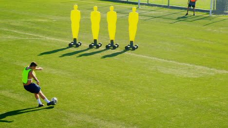 soccer player kicking the ball toward the goalpost 4k