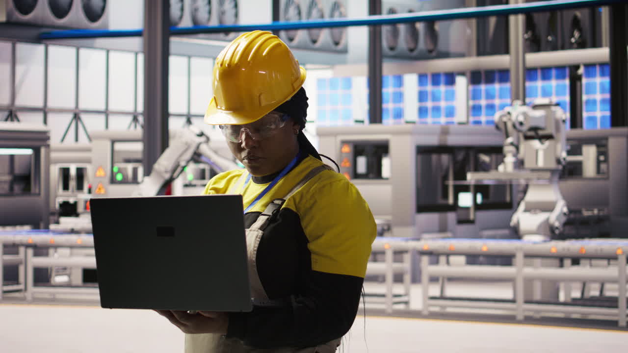 Vertical video Portrait of smiling solar panels factory engineer analyzing data on laptop