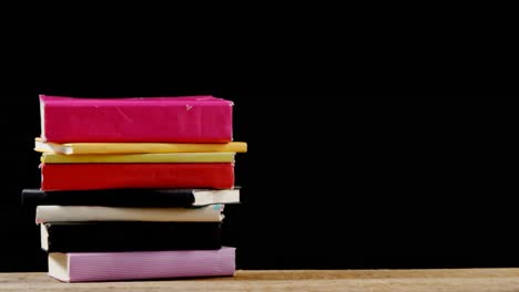 stack of various book on table