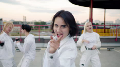 Front-view-of-girl-leader-dancing-with-the-group-behind