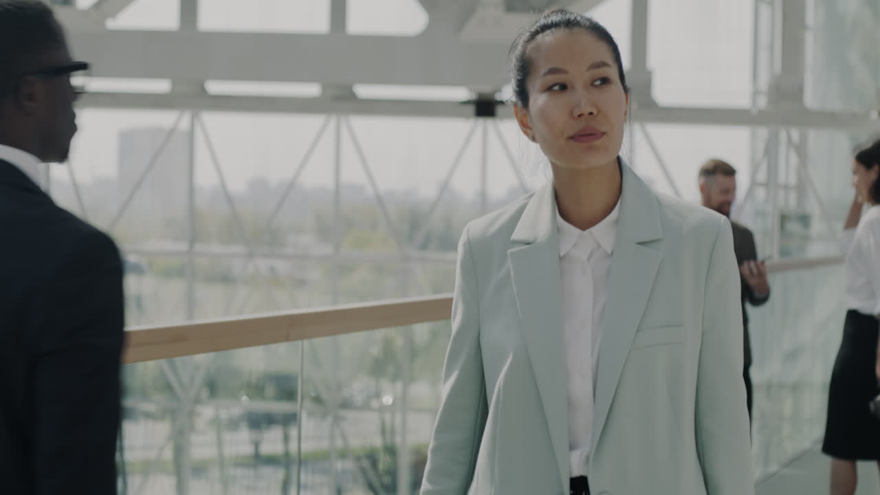 Businesswoman Walking in Modern Building