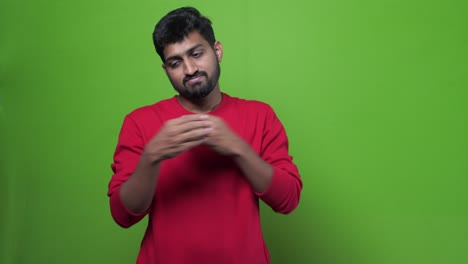 angry young  bearded indian man with red tshirt