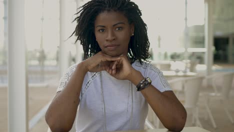 beautiful african american woman looking at camera.