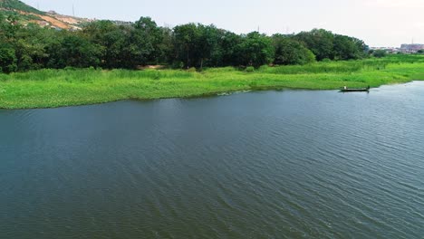 4K-footage-of-a-lake-with-rippling-surface-effect-and-green-plants