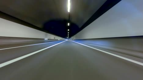 fast driving by a tunnel with preponderance in the center. vehicle shot