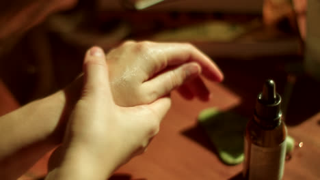 applying hand cream or oil