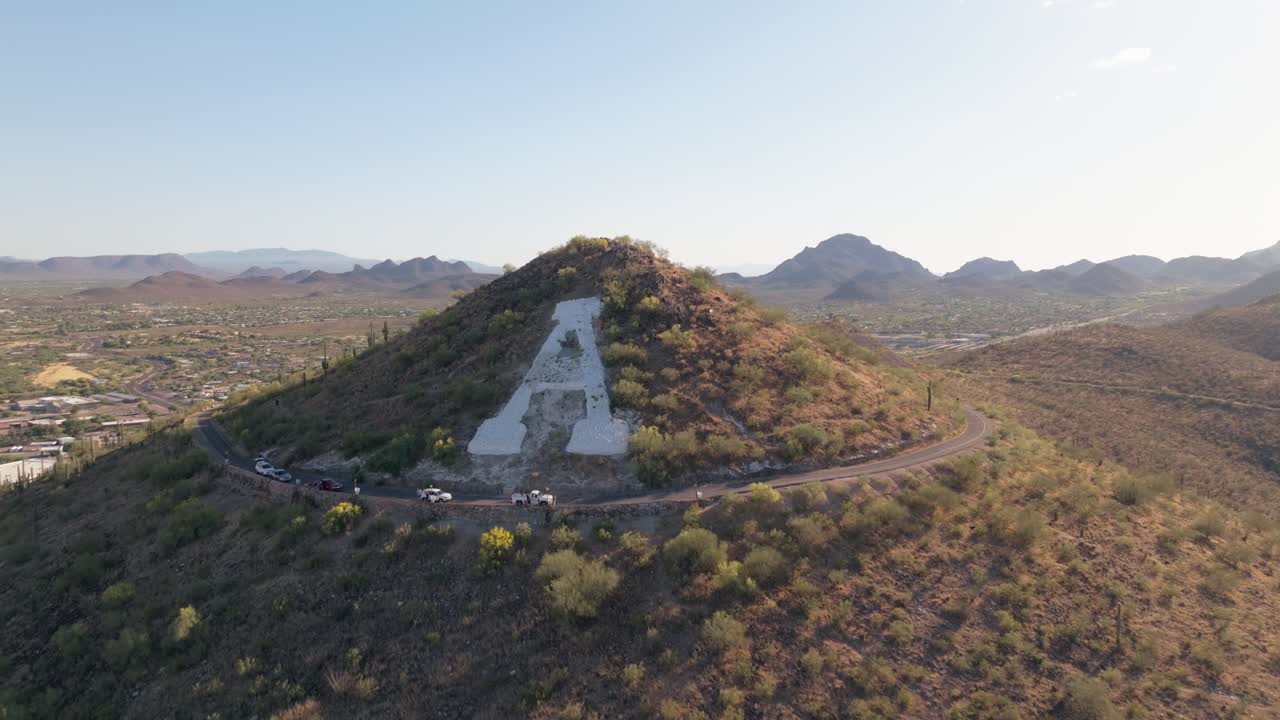 Aerial View of A Mountain in Desert Landscape with Winding Road