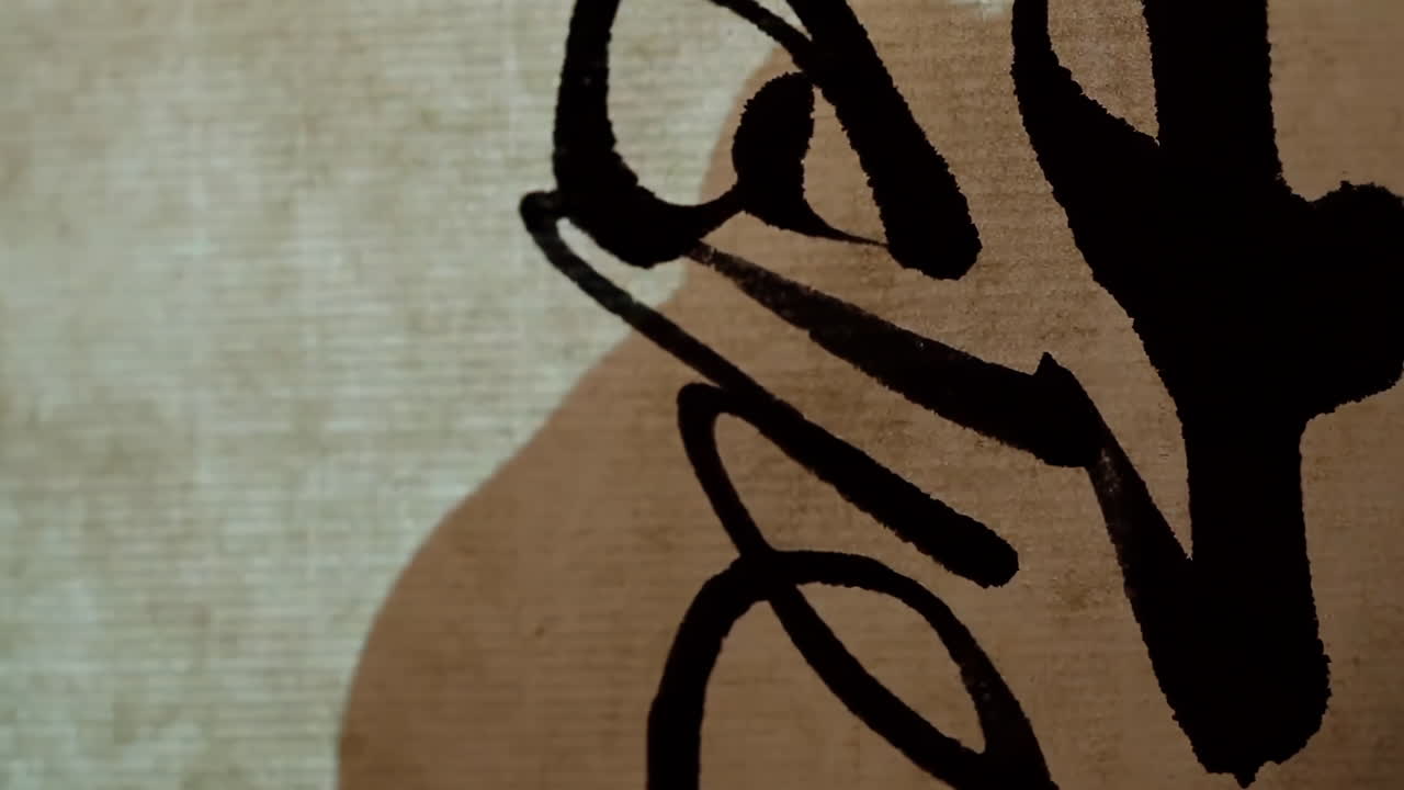 Ink painting calligrapher is writing brush characters, creating Chinese calligraphy works. Translation: Spring comes, the god of wind arrives.