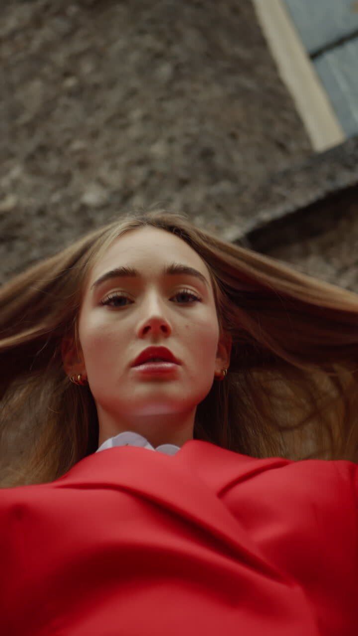 Woman in Red Blazer and White Shirt
