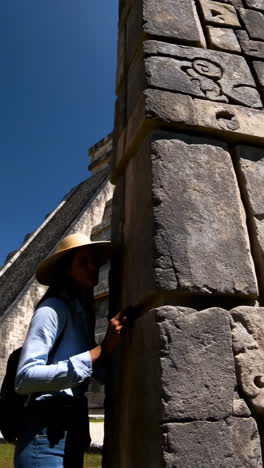 woman exploring mayan ruins